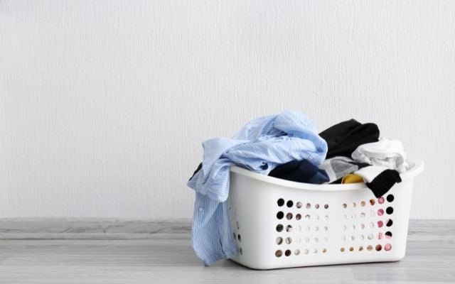 colored laundry in white basket