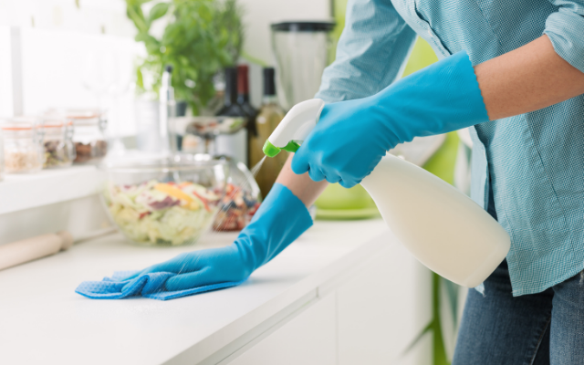 Woman cleaning kitchen